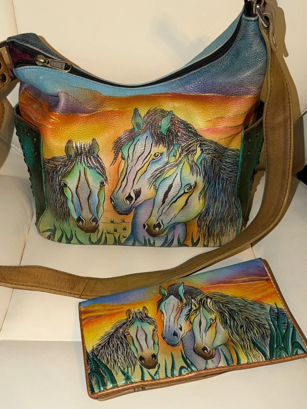 Anuschka hand-painted leather wallet featuring a vibrant 